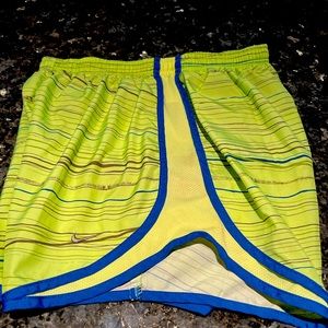 Like New Ladies Nike running shorts Yellow and Blue trim Size Med